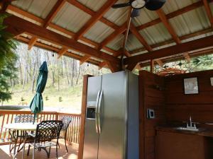 Big Rig Friendly! Cement parking pad, gazebo with refrigerator and ice maker. Pet containment area with picnic table and fire pit.