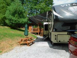Site #7 at Deer Springs RV Park. Very private, pull through site. Lots of shade! Private gazebo, refrigerator, ice maker, picnic table and firepit.