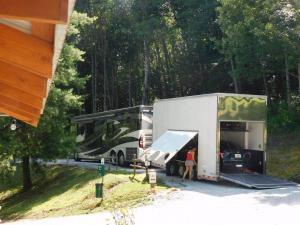 Big Rig Friendly! Private, secluded site with concrete parking pad. Gazebo, refrigerator with ice maker, picnic table, fire pit, and nice views.